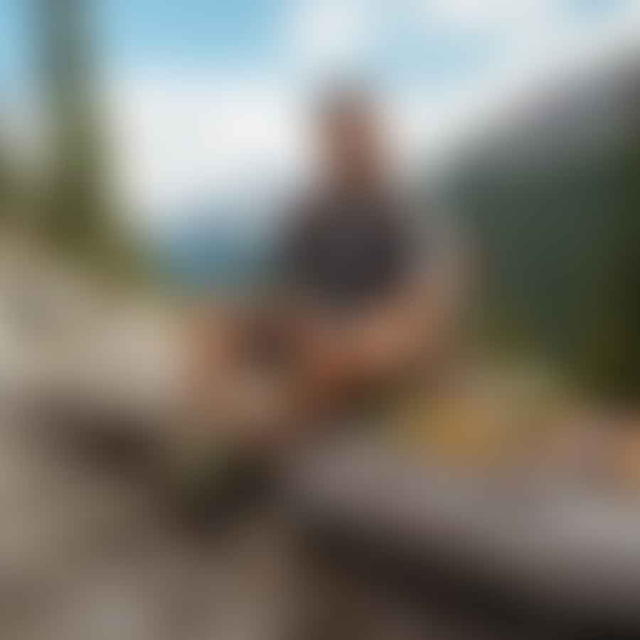 A hiker sitting on a log during a break, surrounded by a variety of energy-boosting snacks such as energy bars, trail mix, fresh fruit, nut butter with apple slices, and veggies with dip. The hiker is enjoying a healthy snack while admiring the beautiful outdoor landscape of the hiking trail.